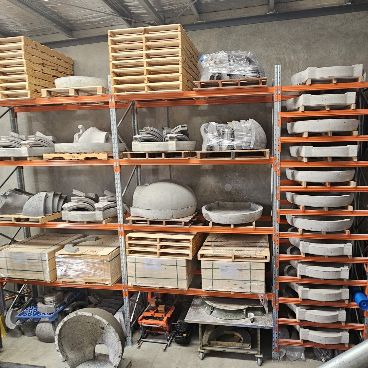 Precast wood-fired pizza oven components stored in the Pizza Oven Club workshop in Landsborough, Sunshine Coast.