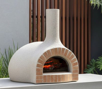 White Pizza Oven Club wood-fired pizza oven with a brick-finished entrance in an outdoor kitchen setting.
